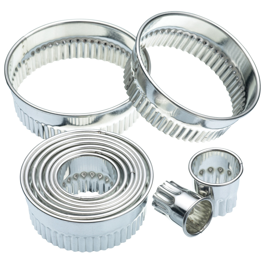 Eleven Flutted Pastry Cutters & Storage Tin
